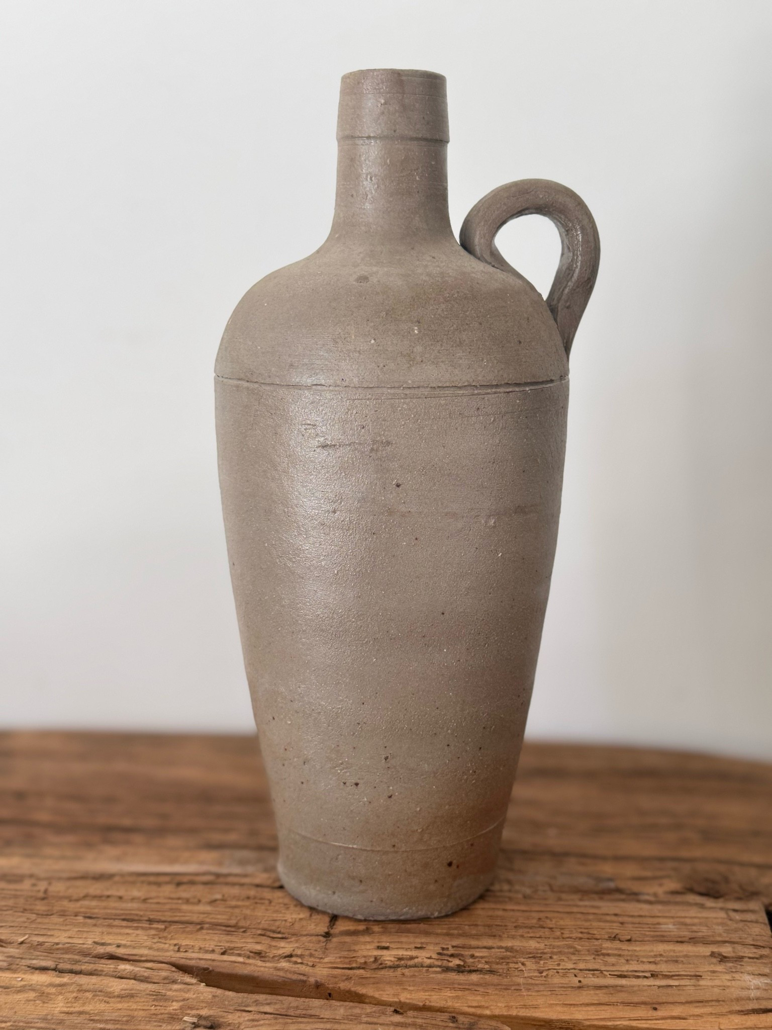 The beauty is in the simplicity.

A timeworn French stoneware bottle with soft neutral tones and the kind of character only age can create. Collected in France and perfectly at home among books, pottery, and natural textures.

#LTKHome