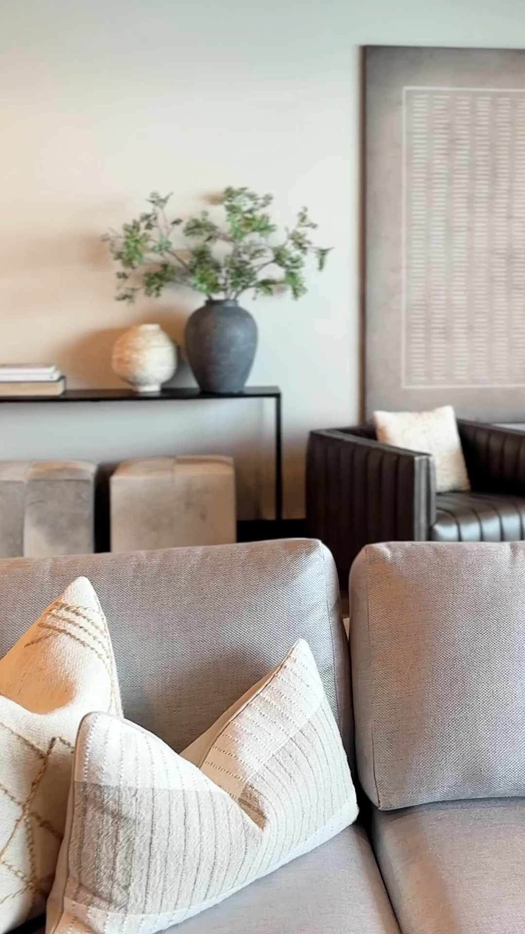 This is what organic modern dreams are made of 🤎

Layered textures. Bold contrast. Thoughtful styling. From the oversized statement art to the earthy cowhide ottomans, every piece plays a part.

I’m loving how the sculptural pots, stacked books, and square-edged leather swivel chairs add structure, while the metal console table and faux cowhide rug bring just the right amount of edge.

This space feels collected, elevated, and warm — exactly what I wanted.


#LTKSaleAlert #LTKHome #LTKStyleTip