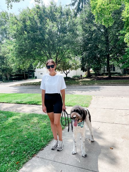 Me telling my dog to smile 👉🏻 😬 This top is a winner (check my Amazon shop) and I don’t need to go into detail about amazing bike shorts. Happy Tuesday that feels like a Monday! #dogmom #dogwalker #itsstillsummer #bernedoodle