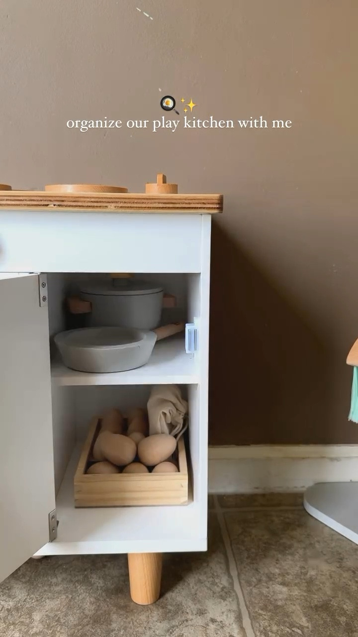 organize my sons play kitchen with me 🍳✨ This play kitchen is hands-down my son’s favorite toy—and it’s no wonder why. From slicing velcroed wooden veggies to whipping up pretend meals in his apron and chef’s hat, he’s learning life skills while having so much fun. 

The wooden utensils and play food make it the perfect hands-on activity for creativity and fine motor development. Plus, organizing it all? A mom win! 🧺💛

Play kitchen + Mini Chef Apron Set: @lalo (use code OXMXL to save)

#MontessoriToys #PlayKitchenGoals #IntentionalParenting #ToyOrganization #MontessoriParenting”

#LTKFamily #LTKKids #LTKGiftGuide