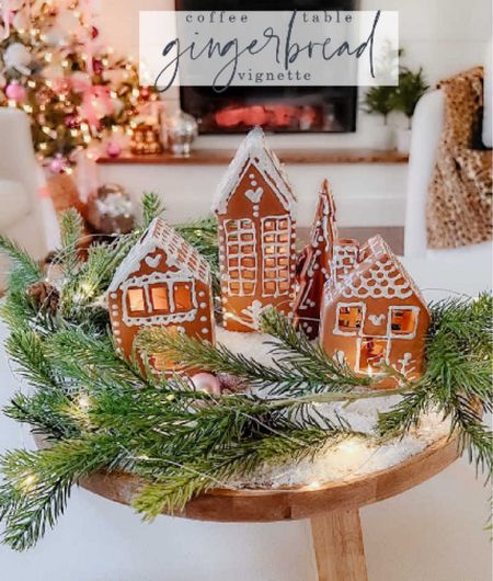 Make a gingerbread house centerpiece! Spray paint ceramic houses, add puffy paint details. Place on a wood footed tray with faux snow, branches and twinkle lights for a magical holiday focal point for your coffee table, dining table or kitchen island! My wood pedestal is not sold anymore but I linked some similar risers. And my houses are not sold anymore but i linked similar ones :)

#LTKhome #LTKHoliday