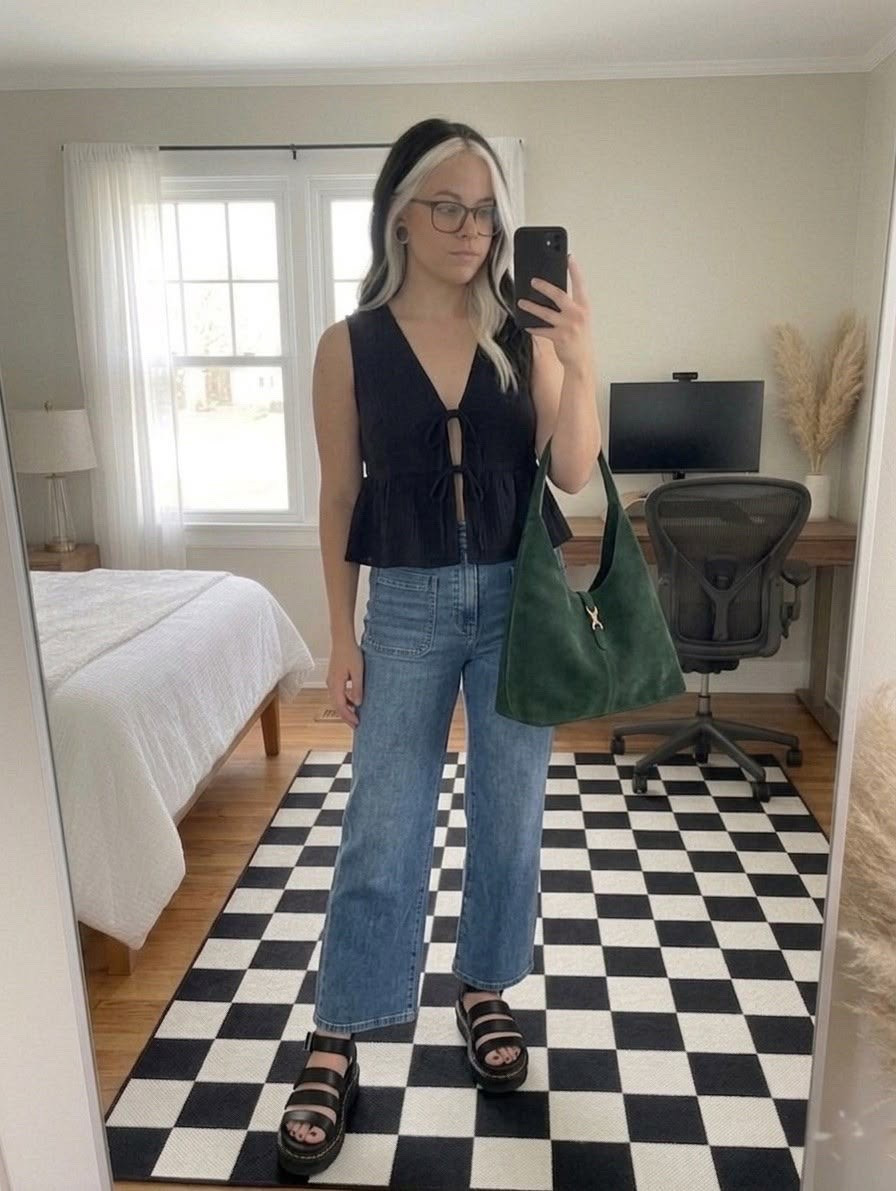 Obsessed with this transitional look! This black tie front peplum top is the perfect mix of feminine and edgy. Paired it with my favorite high waisted wide leg jeans and chunky platform sandals for an elevated casual vibe. Don’t forget a pop of color; this green suede hobo bag is the ultimate statement piece for any season.

#LTKmomlife #LTKSeasonal #LTKSaleAlert