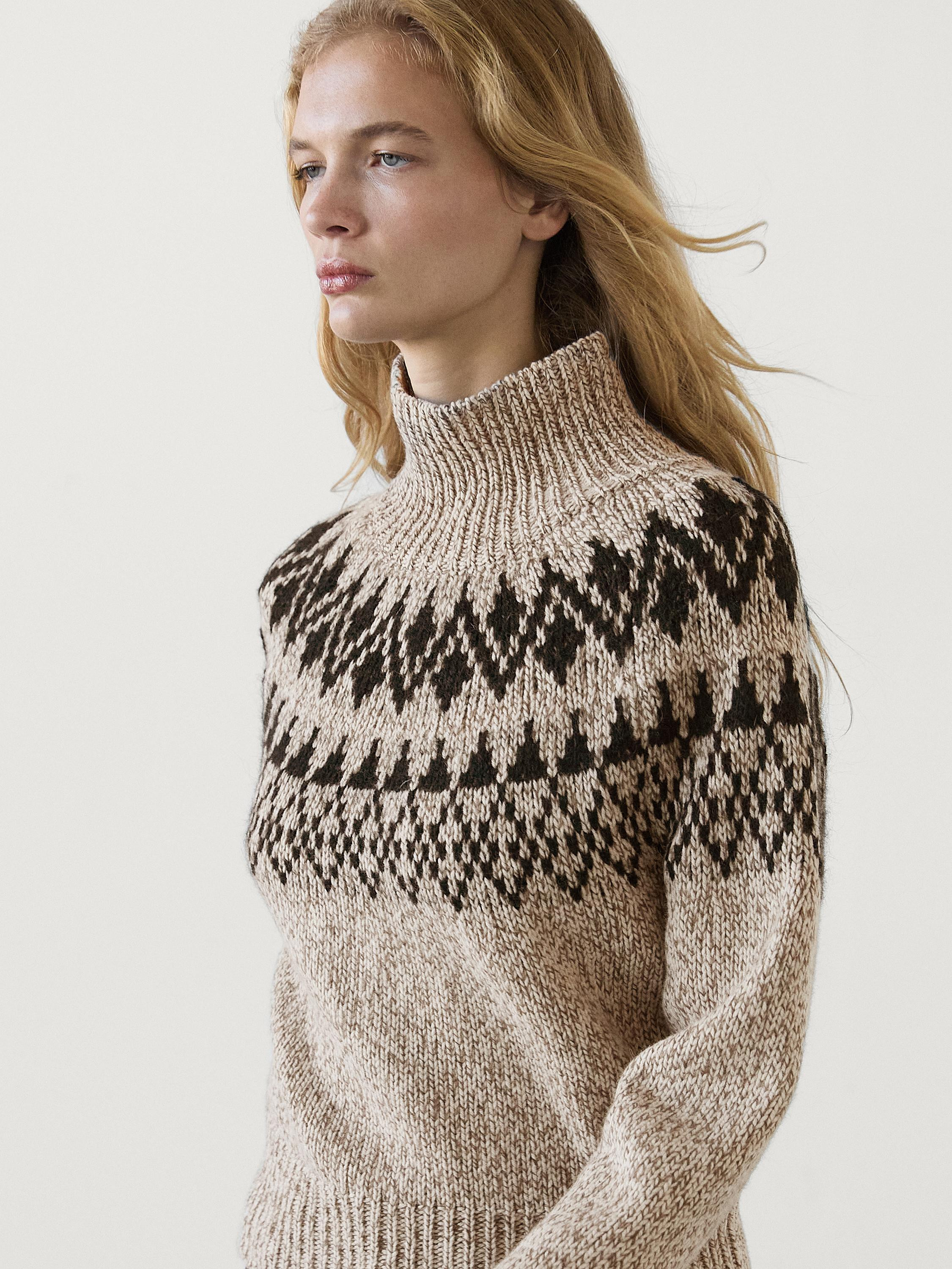 Knit sweater made of a wool blend fabric . High neck. Jacquard fabric. Ribbed trims . Made in mou... | Massimo Dutti UK