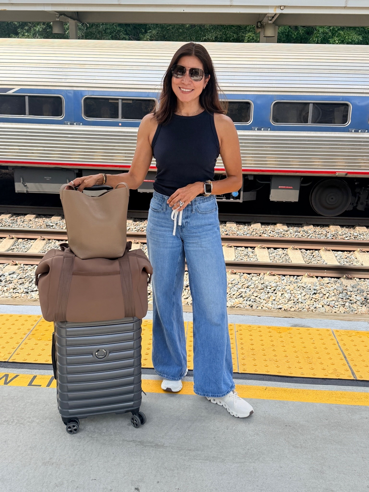 Train travel look. Comfy drawstring jeans and sneakers. 

Loving my carry on and purse @Quince 
Looks nice & good size

#LTKootd #LTKSeasonal #LTKTravel