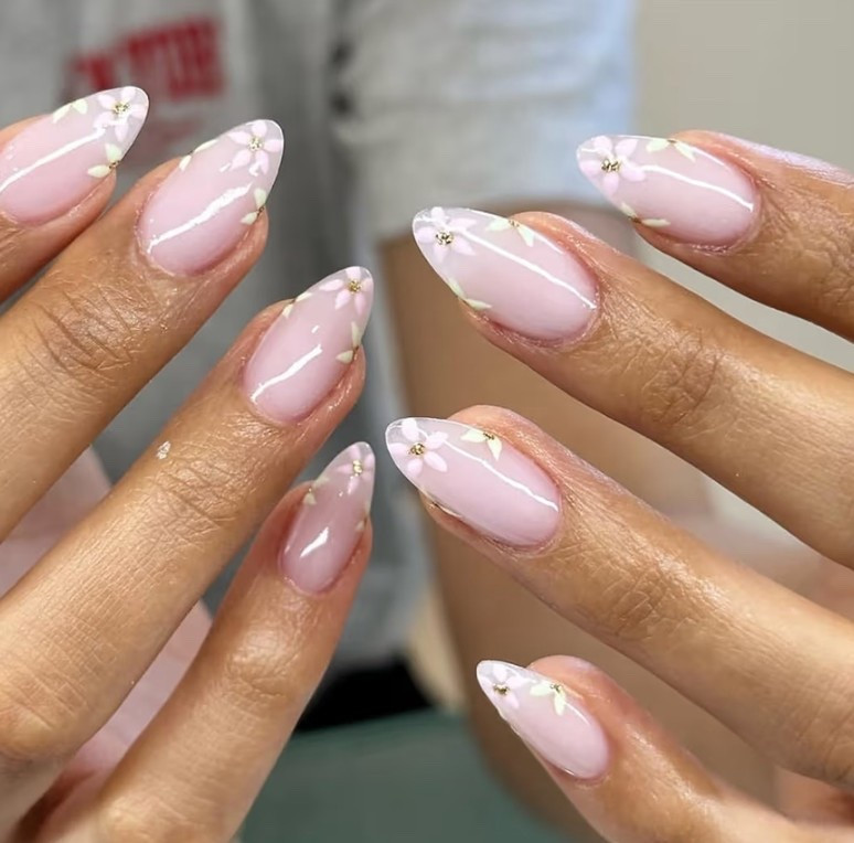 These nude pink almond press on nails are giving expensive spring manicure. Floral details with subtle gold glitter in a medium length that looks clean, feminine, and polished. Easy stick on nails that last, reusable, and perfect if you want cute spring nails without a salon appointment.

#LTKgrwm #LTKBeauty #LTKValentine