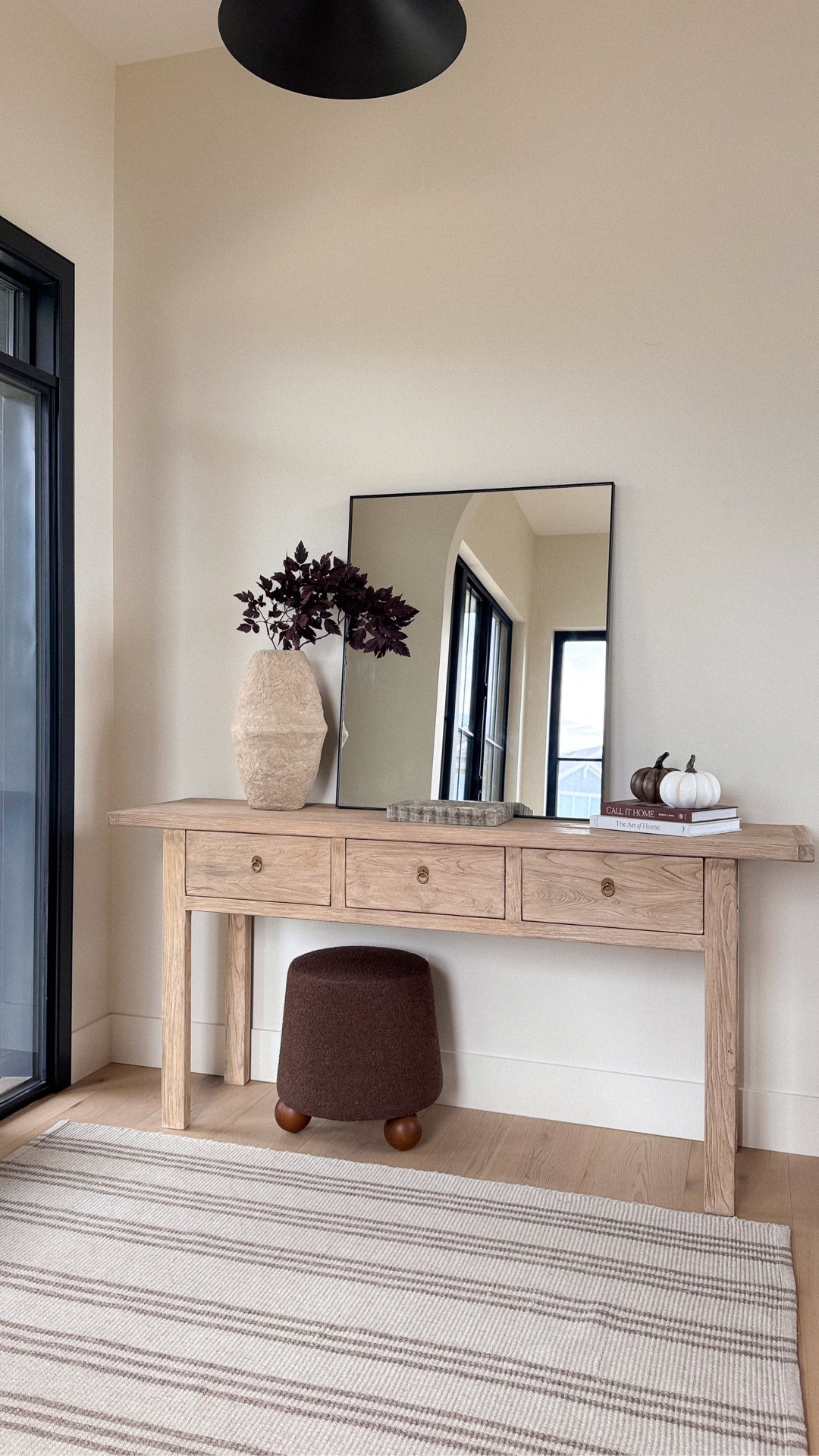 Bring cozy fall vibes to your entryway with these stunning @wayfair styling essentials. The arched mirror is perfectly on-trend and perfect for a quick outfit check on your way out, while the earthy striped rug grounds and elevates the space. The organic modern paper mâché vase makes the perfect vessel for autumn ruscus stems, and the chic resin pumpkins add just the right touch of fall charm! #Wayfair #wayfairpartner #Ad 

 

#LTKSeasonal #LTKHome #LTKFindsUnder100