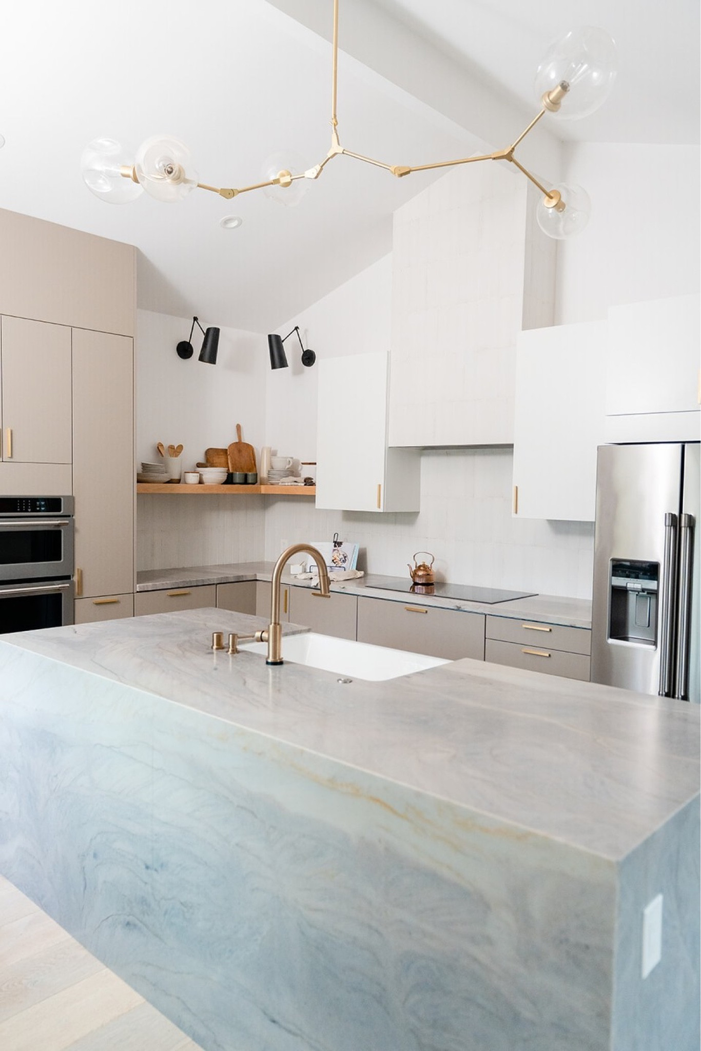 Modern infused kitchen

Adjustable sconces, floating shelves, mid century modern chandelier, west elm mugs, crate & barrel plates, arhaus reclaimed wood vase, copper teapot, vintage cutting boards, stoneware utensils holder, wooden kitchen utensils, brass hardware.

Kitchen, kitchen accessories, home decor, home finds, interior design, kitchen design, kitchen decor. 

#LTKFind #LTKstyletip #LTKhome