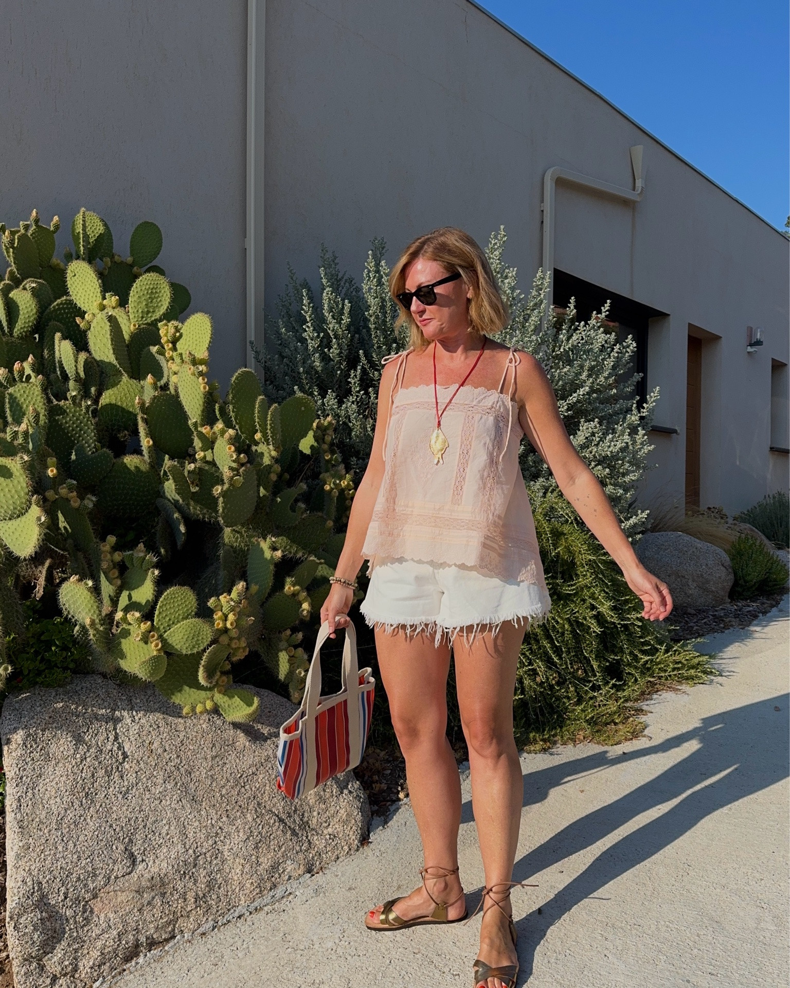 White denim shorts and cotton lace cami
Holiday outfit

#LTKsummer #LTKuk #LTKeurope