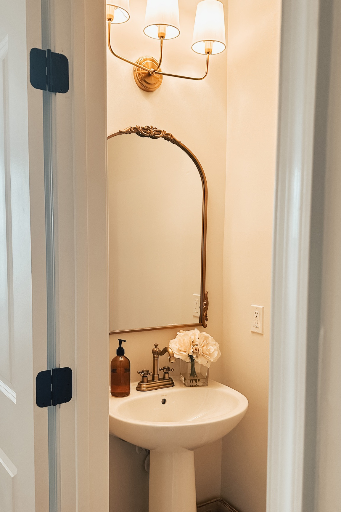 Powder bath update | gold bathroom | brass faucet | brass light fixture | brass mirror | gold mirror | pedestal sink | half bath 

#LTKhome #LTKunder100