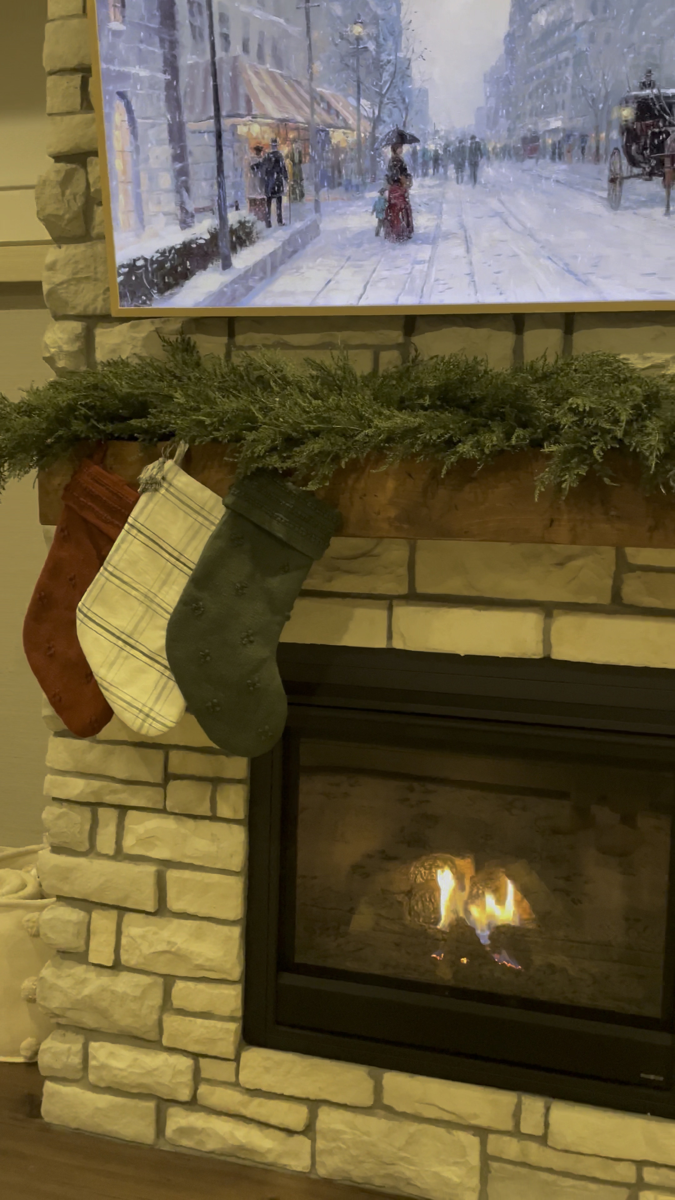 finally got my mantle decorated for christmas 🥰 my exact garland is from nearly natural but is currently sold out so I linked some similar versions! 🎄 christmas home decor | holiday home decor | faux greenery | garland | holiday garland | stockings | christmas aesthetic

#LTKHoliday #LTKSeasonal #LTKhome