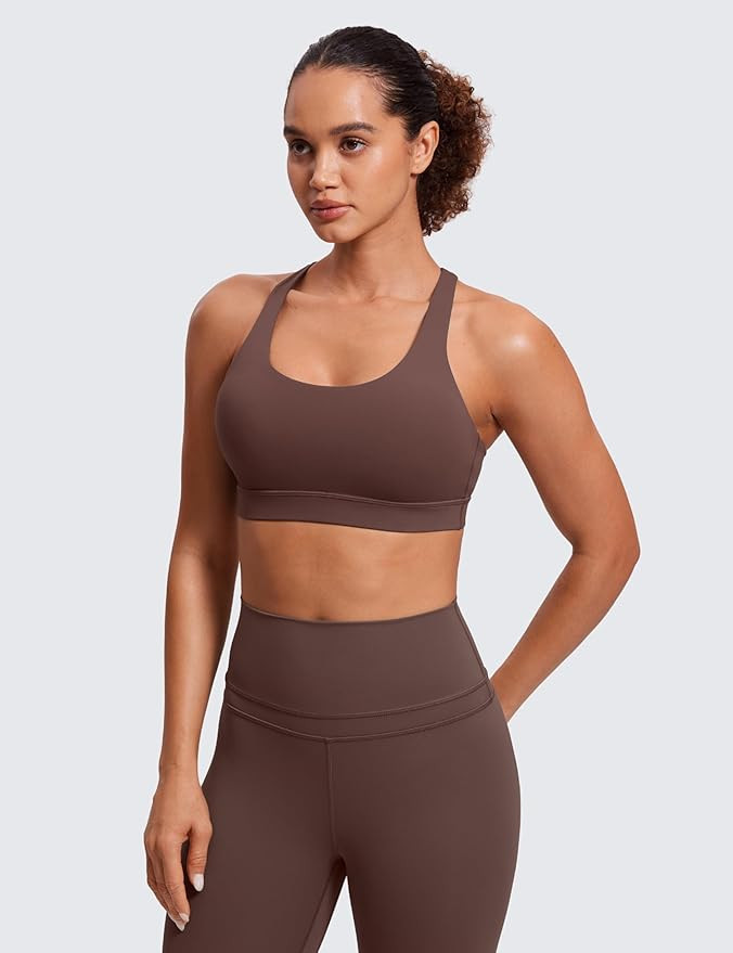 CRZ YOGA Women's Strappy Sports Bras Fitness Workout Padded Yoga Top Criss Cross Back Cami | Amazon (US)