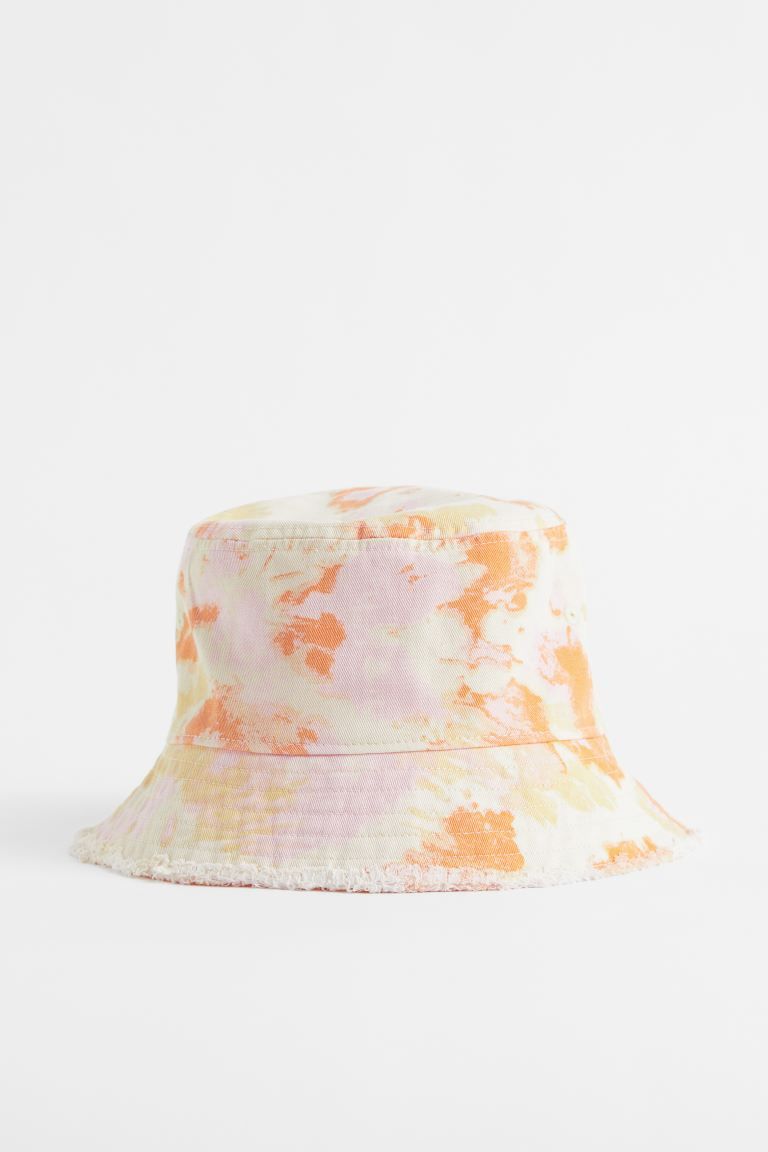 Bucket hat in cotton twill with embroidered eyelets and sloped brim. Lined.CompositionCotton 100%... | H&M (US + CA)