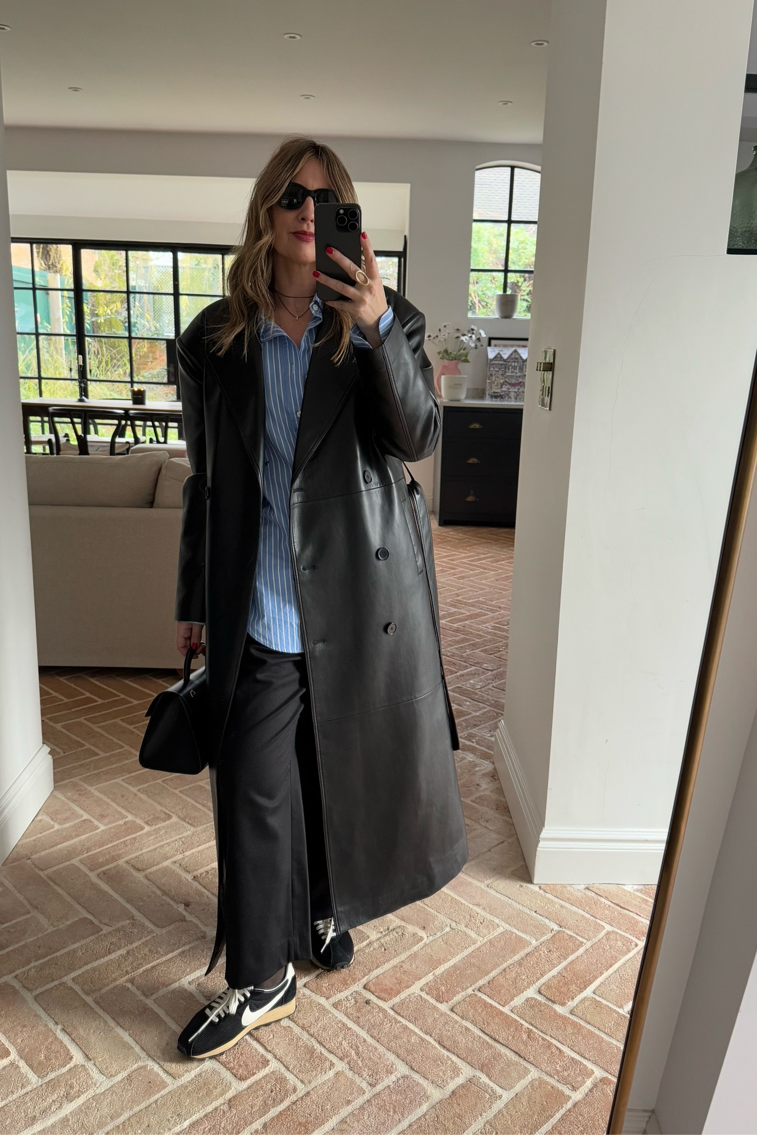 Long leather trench + striped blue shirt + tailored trousers + Nikes 

Shopping outfit idea | brunch outfit 

#LTKgrwm #LTKeurope #LTKstyletip