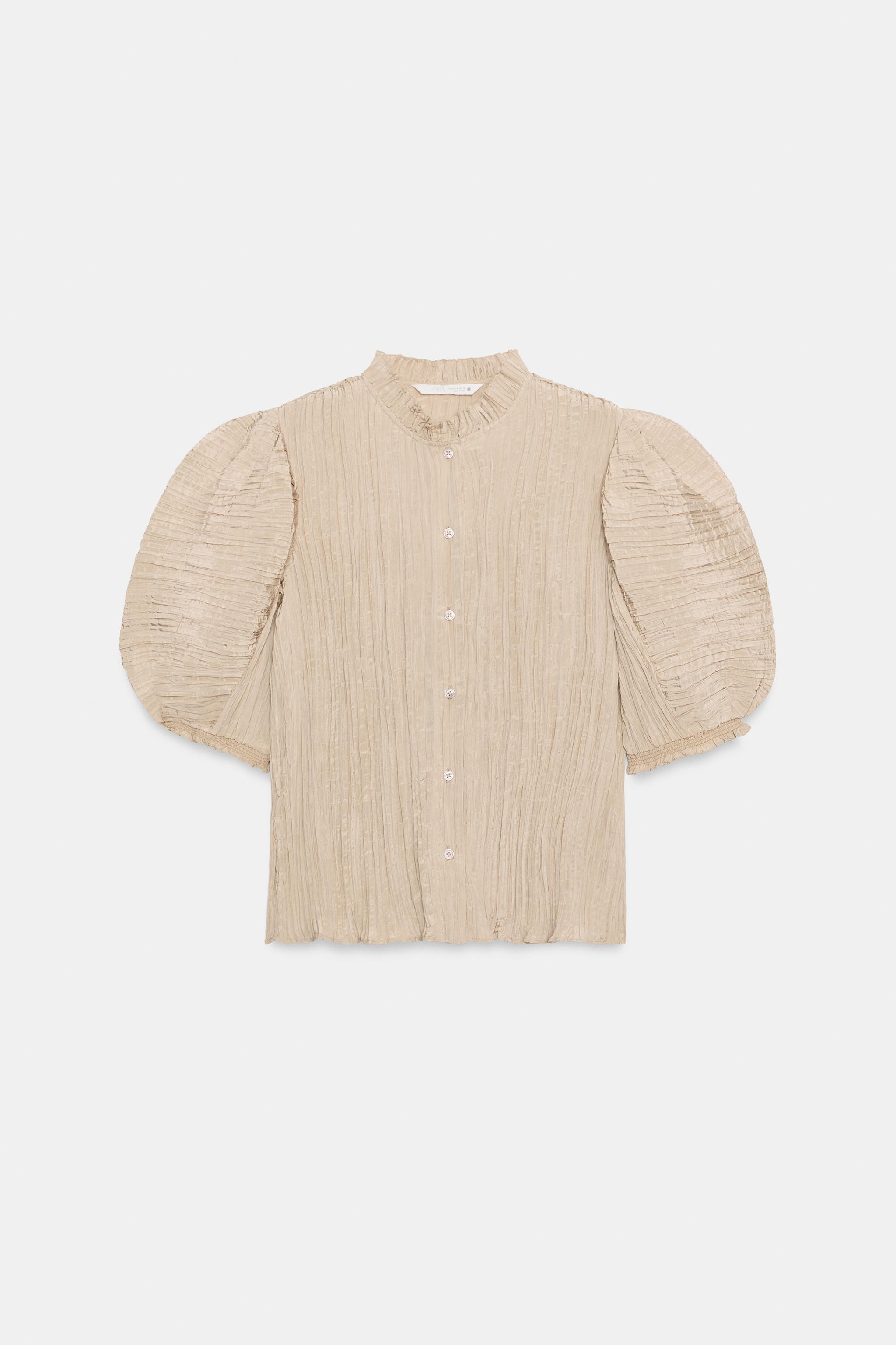 ZARA WOMAN COLLECTIONShirt with a round neck and short puff sleeves. Pleated fabric detail. Strai... | Zara US