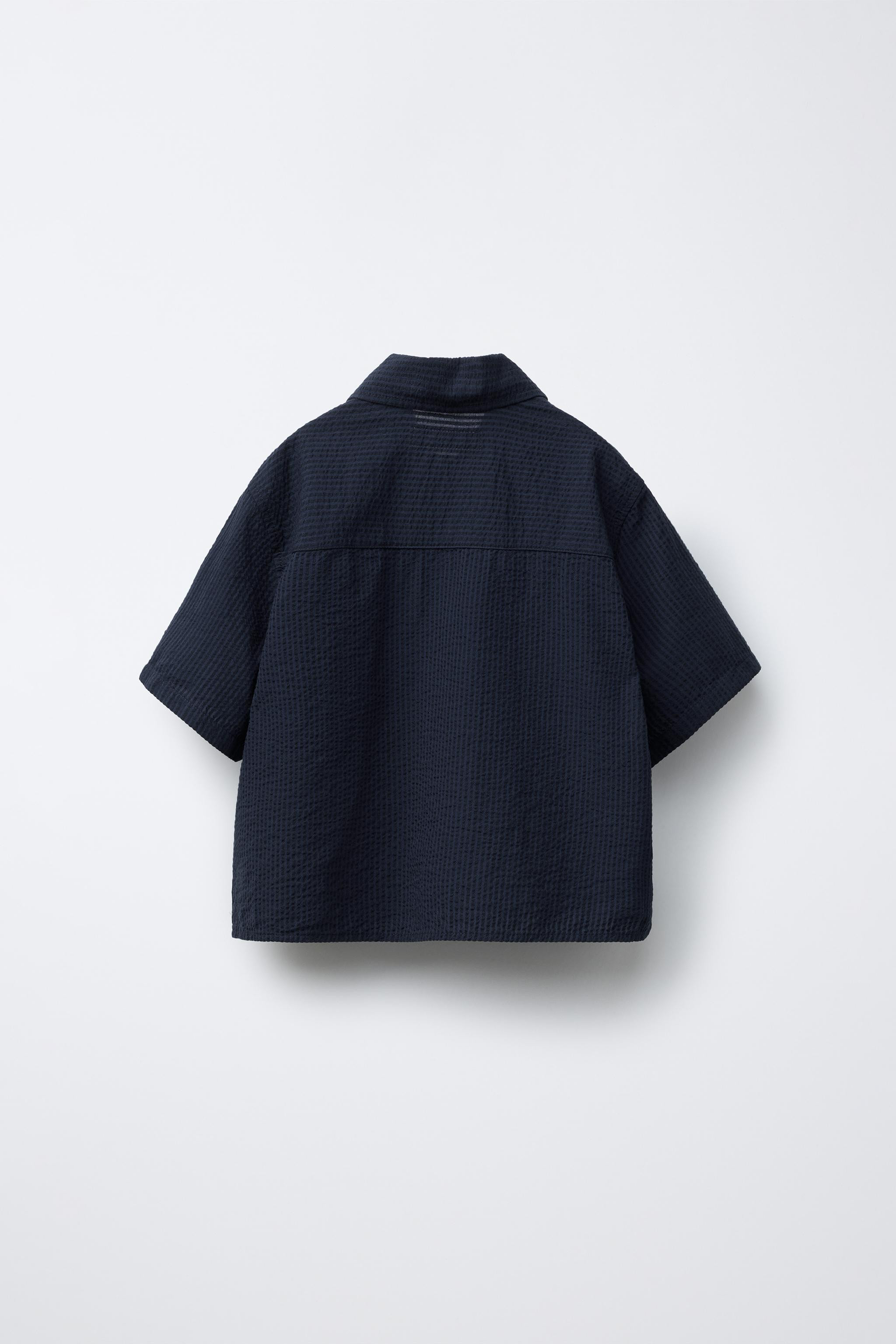 Shirt with collared neckline and short sleeves. Front button closure. Patch pocket on chest. | Zara US