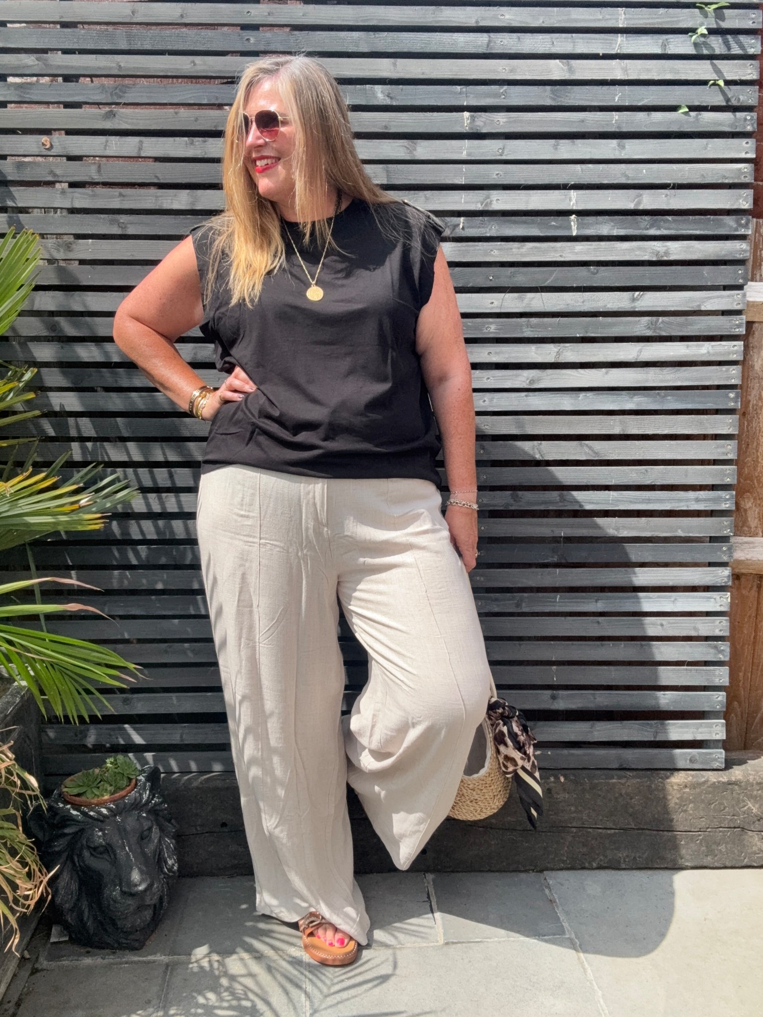 Black tshirt, linen trousers, straw bag; sunglasses, sandals 

#LTKplussize #LTKsummer #LTKcurves