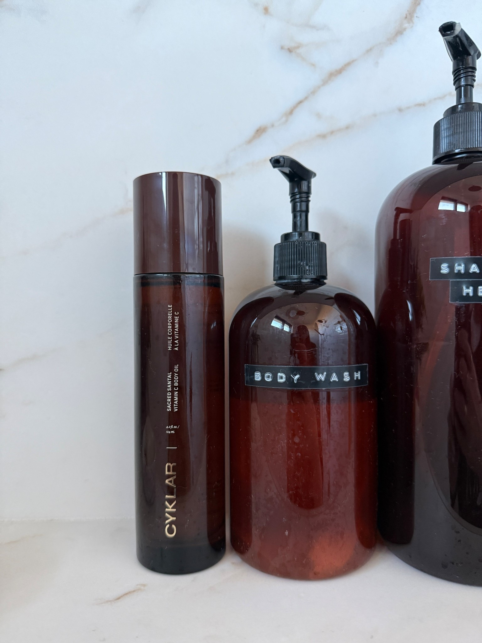 This vitamin c body oil is SO good. Also highly rec swapping out your ugly shampoo/conditioner bottles for these amber ones - instant bathroom glow up!

#LTKselfcare #LTKmorningroutine #LTKHome