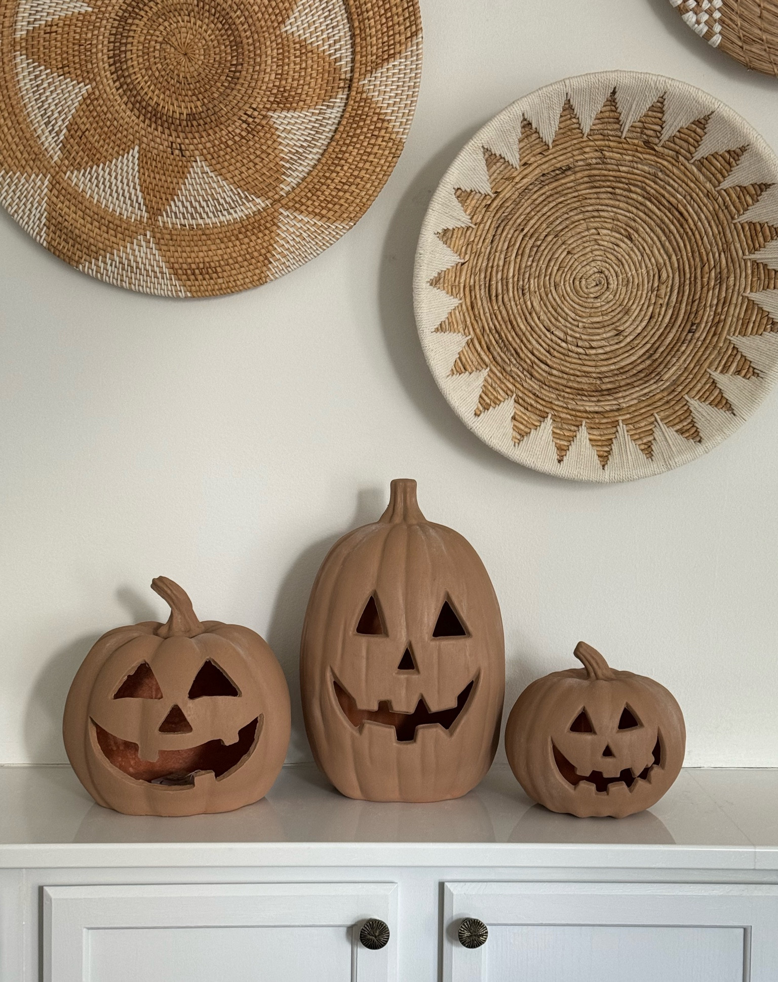 Pottery Barn Terracotta Pumpkin DIY ✨ I had so much fun creating the viral pottery barn terracotta jack o’ lanterns for a fraction of the price! I love the way they turned out and add a fun element to my Halloween decor. 

Steps:
1. Choose your jack o lanterns or pumpkins. 
2. Mix baking soda with Sherwin Williams Terracotta Urn paint. The $7 sample size is more than enough! 
3. Paint with baking soda mixture. I did about two coats. 
4. Once dry, dab with loose chalk or chalk powder. 

Halloween, Halloween decor, dupe, pottery barn, pottery barn dupe, DIY, terracotta, neutral home, jack o lantern, pumpkin 



#LTKHome #LTKSeasonal #LTKHalloween