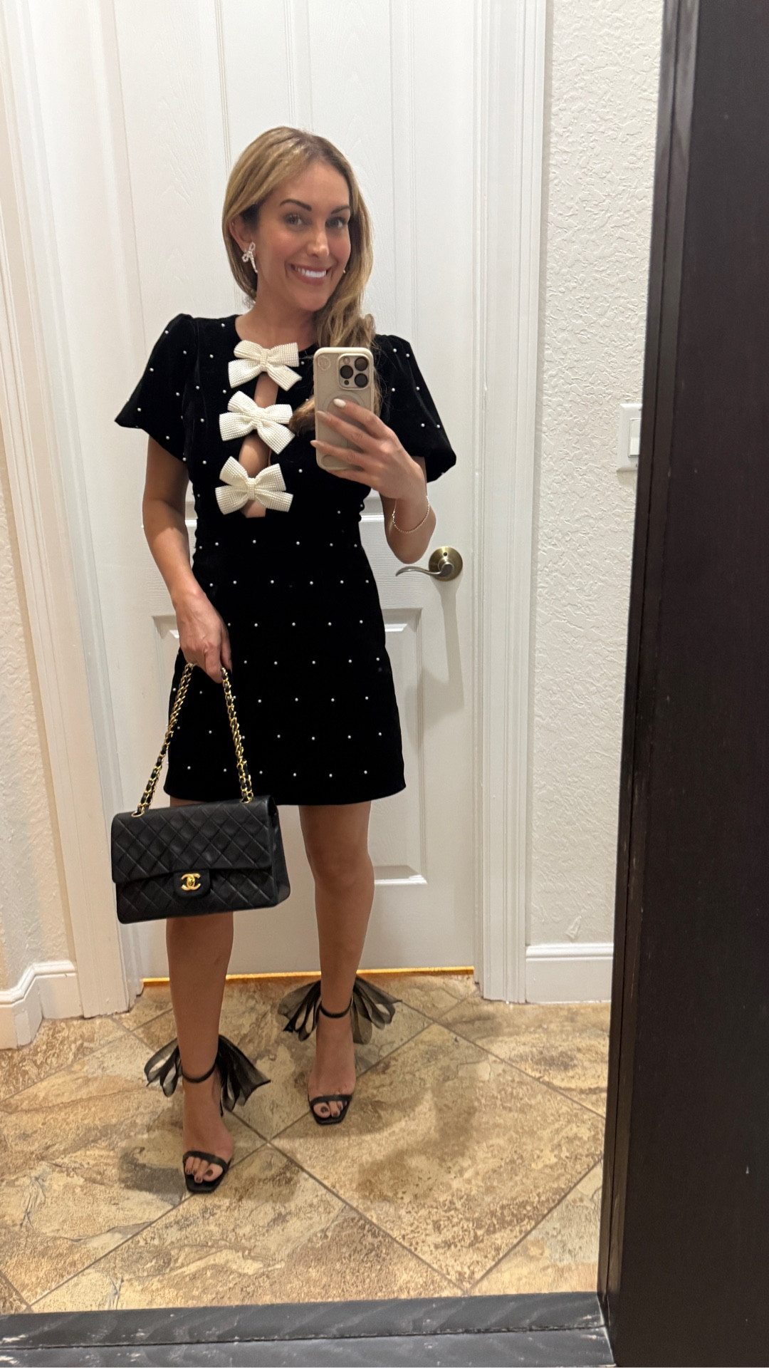 Obsessed with Vici dolls black and white holiday dress with the pearl appliqué perfect for any holiday event!!! I paired it with my black heels with a bow and my classic Chanel double flap. Don’t forget my pearl bow earrings. 🤍🖤

#LTKFindsUnder100 #LTKHoliday #LTKSeasonal