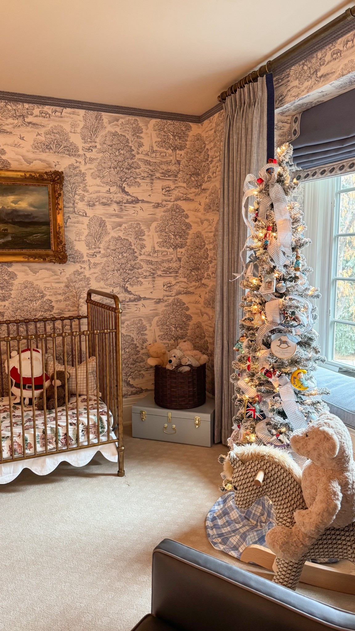 Our little Nicholas’s sweet Christmas nursery! 🎅🏼 Soft blues with pops of festive red… A tree with a few British touches and lots of blue and white gingham. It’s a special time of year because I remember being so pregnant with him two Christmases ago and feeling so excited to meet him… And now he’s here, watching his sweet big sissy decorate his tree with me! 