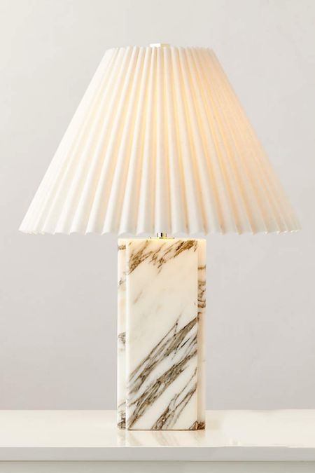 BIANCA WHITE MARBLE TABLE LAMP

Simple in form and daring in adornment, table lamp incorporates elevated materials throughout. Active Italian Arabescato Corchia marble features purple and white tones and neatly carved edges. On top, ivory linen shade looks graceful with well-placed pleats, making this a lamp that deserves prominent display. Each piece will vary due to the inherent activity of marble.

#LTKHome #LTKStyleTip