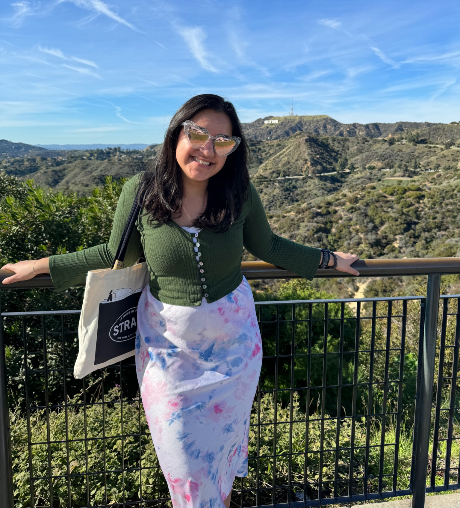 Sunny and smiling in L.A.! Love this green sweater from Reformation and a colorful midi skirt combo 

#LTKU #LTKfindsunder50 #LTKtravel