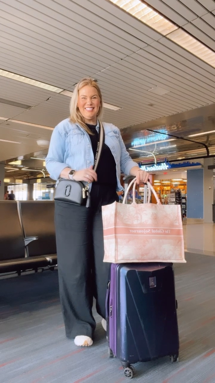 Travel OOTD. 
Black linen pants 
Black sweater tank 
New balance 327 sneakers 
Denim jacket 
Marc jacobs cross body bag
Travelpro 21 inch hard side spinner carry on suitcase 
Lily & Bean (Dior inspired) tote bag


#LTKmidsize #LTKtravel #LTKcurves