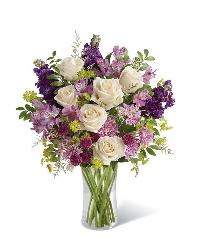 Delight your loved one with this lush bouquet of vibrant purple blooms, perfect for Mother’s Day, birthdays, or any heartfelt occasion. Beautifully arranged in a cylinder vase and hand-delivered by a local florist for a truly special touch. ON SALE and under $60. Deluxe arrangement is shown.

Includes:
• Crème Roses
• Lavender Alstroemeria
• Purple Stock
• Purple Button Chrysanthemums
• Lavender Cushion Spray Chrysanthemums
• White Limonium
• Bupleurum
• Huckleberry
• Cylinder Vase

#LTKSeasonal #LTKMothersDay #LTKSaleAlert