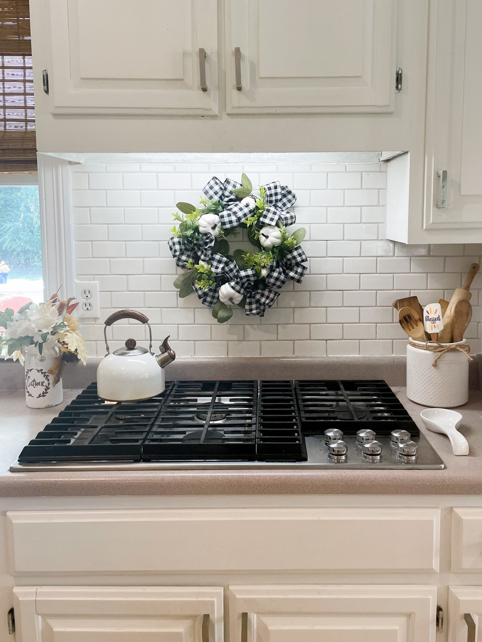 This is the perfect spot for this adorable fall wreath!

Tags:
Amazon fall decor
Amazon fall home
Home decor
Fall wreath
Pumpkin wreath
Neutral fall decor
Neutral pumpkins
Amazon fall kitchen
Amazon kitchen
Utensil holder 
Tea kettle
Spoon rest

#LTKhome #LTKSeasonal #LTKunder50