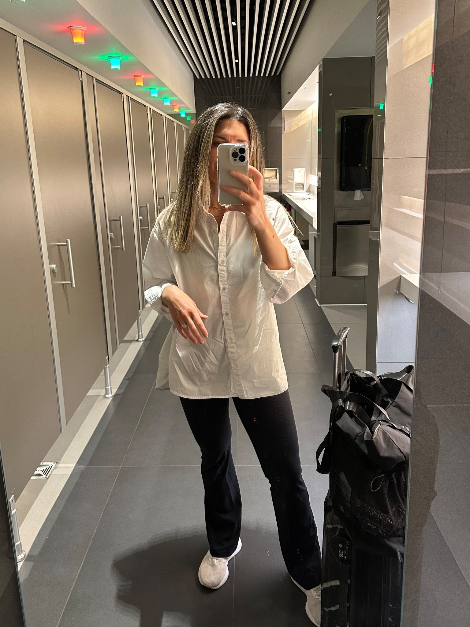 Travel outfit. Mom travel. Casual chic. Mom chic. White button down. Flare leggings. Travel bag. Aerie. Abercrombie. Neutrals. 

#LTKTravel #LTKMidsize #LTKFindsUnder100