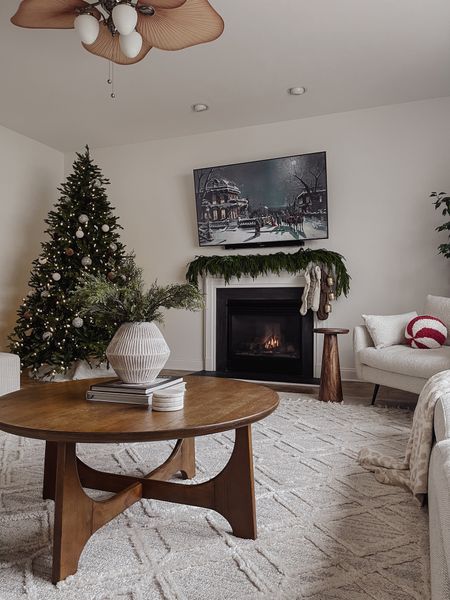 Living room views. Love the neutral Christmas decor for my home. Feels calm and inviting. 

Christmas tree, king of Christmas, fireplace decor, Christmas fireplace decor, garland, neutral Christmas decor, neutral Christmas stockings, target style, Kirkland’s, Norfolk pine garland, layered rugs#LTKHoliday 

#LTKhome #LTKSeasonal
