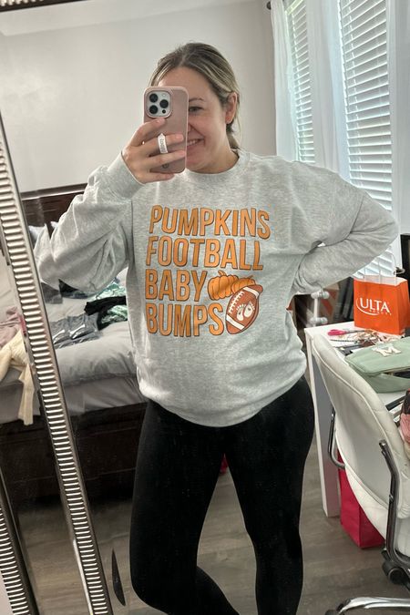 Cutest sweatshirt for fall! Pumpkins, football, baby bumps! Cute for an announcement, weekend, football game, pumpkin patch, etc! Sized up to a large. Wearing softest maternity leggings ever, also sized up to a large! Leggings have the built in belly band  

#LTKbump #LTKfindsunder50 #LTKHalloween