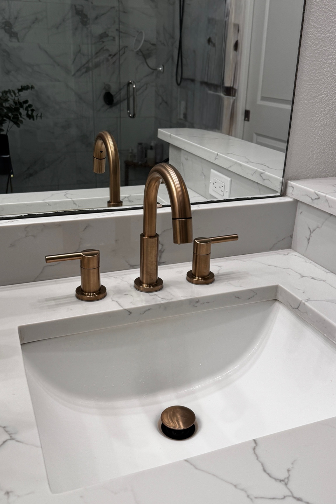 Brushed gold bathroom faucet WITH a sprayer! Great for cleaning the sink :)

#bathroomfaucet #goldfaucet #bathroomdesign 

#LTKHome
