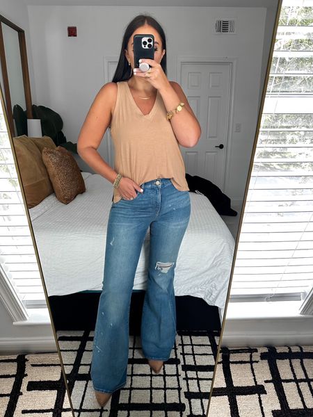 Express Supersoft Linen-Blend Skimming V-Neck Tank wearing size medium $34. Mid Rise Medium Wash Ripped Splatter Paint 70s Flare Jeans wearing size 6 $98

