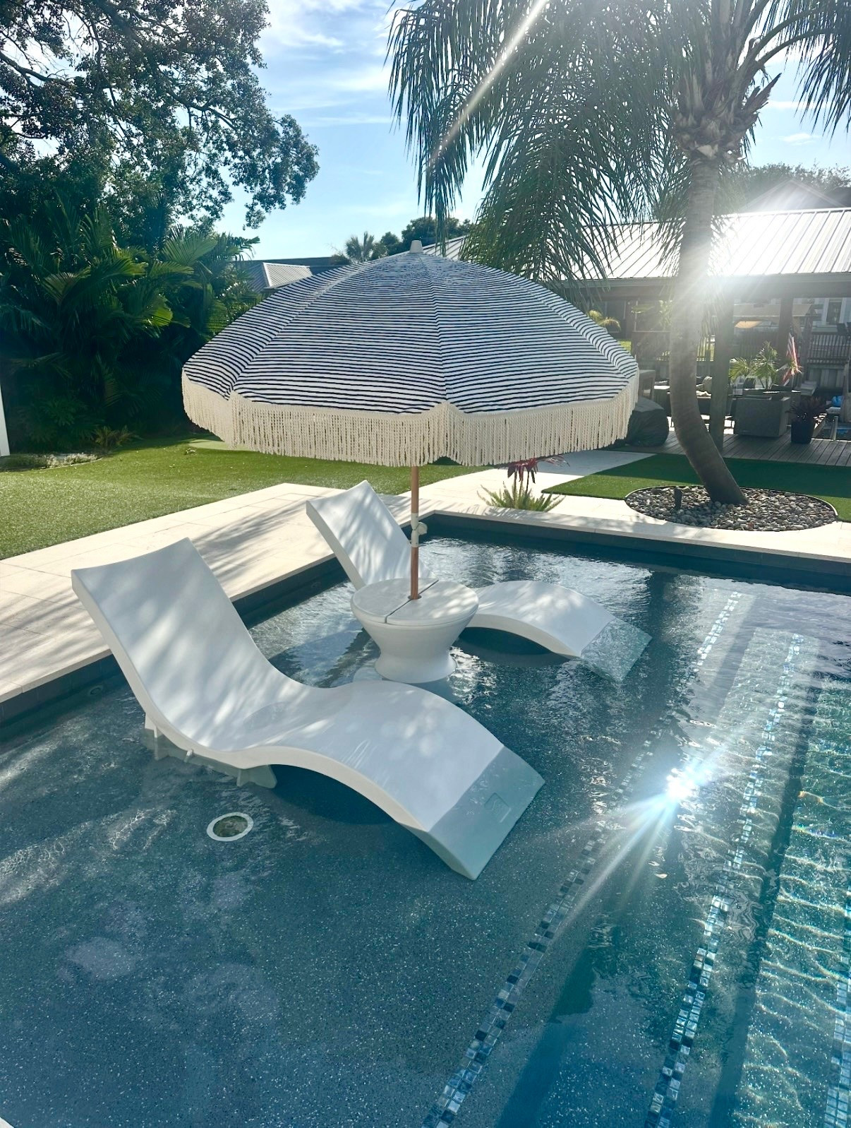 Pool to beach umbrella 
Ledge loungers pool furniture