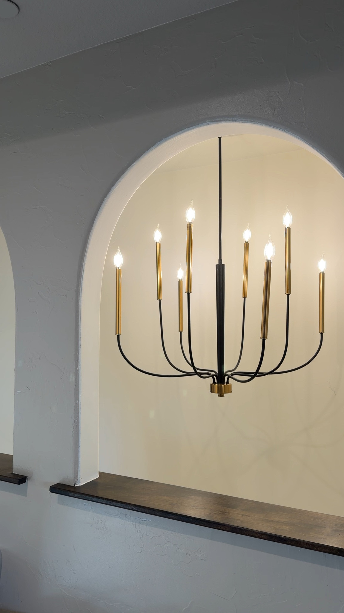 Statement lighting that instantly elevates a space. This modern chandelier with warm brass accents and clean lines is the perfect mix of minimal and timeless.

#LTKSeasonal #LTKHome
