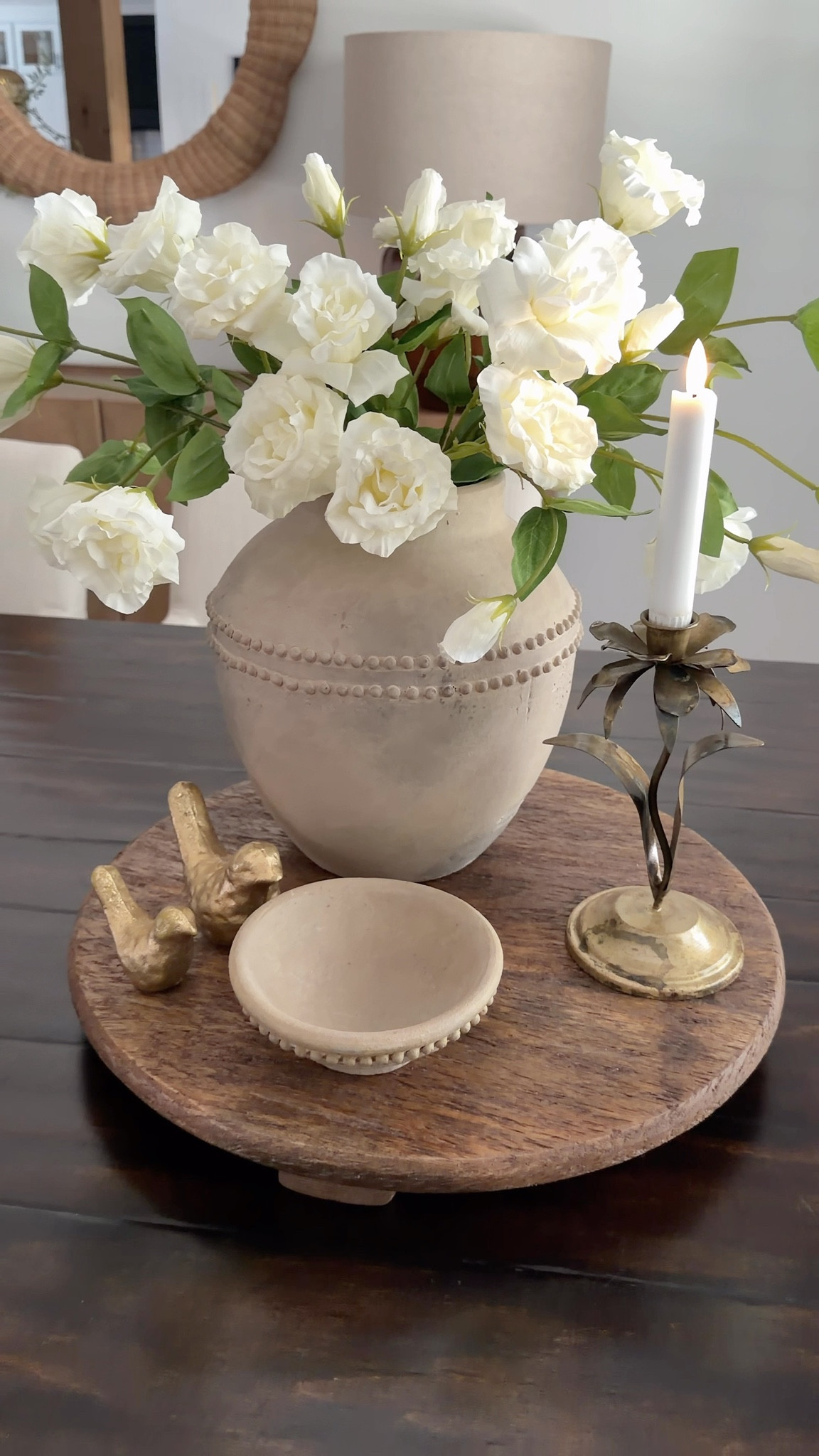 These real touch roses always steal the show! I placed them in a beautiful vase and layered in a gorgeous candlestick, a small pottery bowl, and of course… my gold birds. 