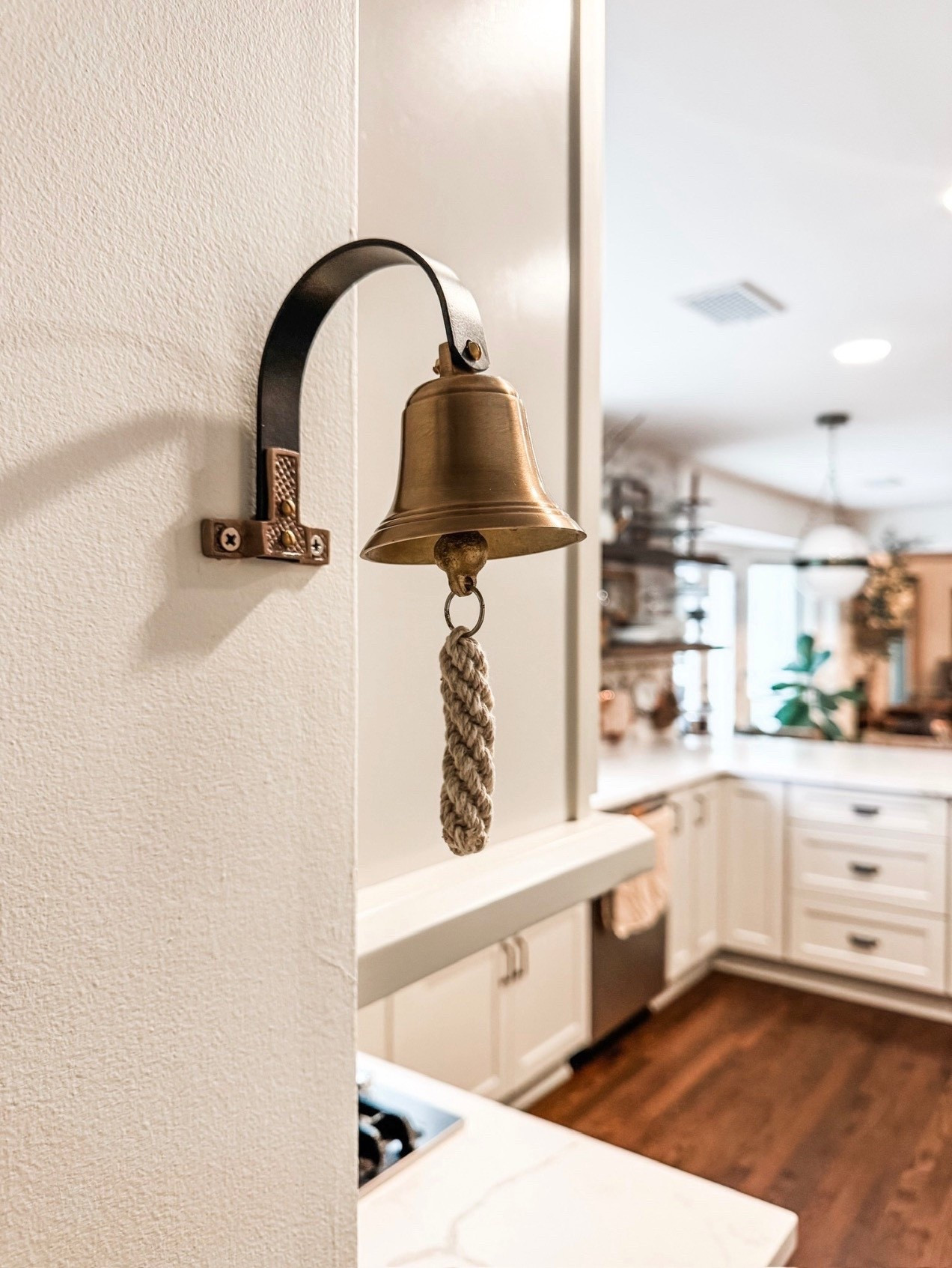 It’s the little details that make a space feel finished ✨ This vintage-style brass wall bell with a rope pull adds so much charm to this white kitchen. Mounted on a painted wall near the kitchen pass-through, it pairs beautifully with white shaker cabinets, brass hardware, quartz countertops, and warm wood flooring. A perfect example of classic kitchen decor with a subtle European farmhouse touch.

#eanesinteriors #kitchendecor #brassdecor #vintagebell #wallbell #farmhousekitchen #whitekitchen #shakercabinets #brasshardware #kitcheninspo #classicdecor #homedetails #interiordesign #ltkhome #ltkdecor

#LTKHome #LTKSeasonal #LTKdayinmylife