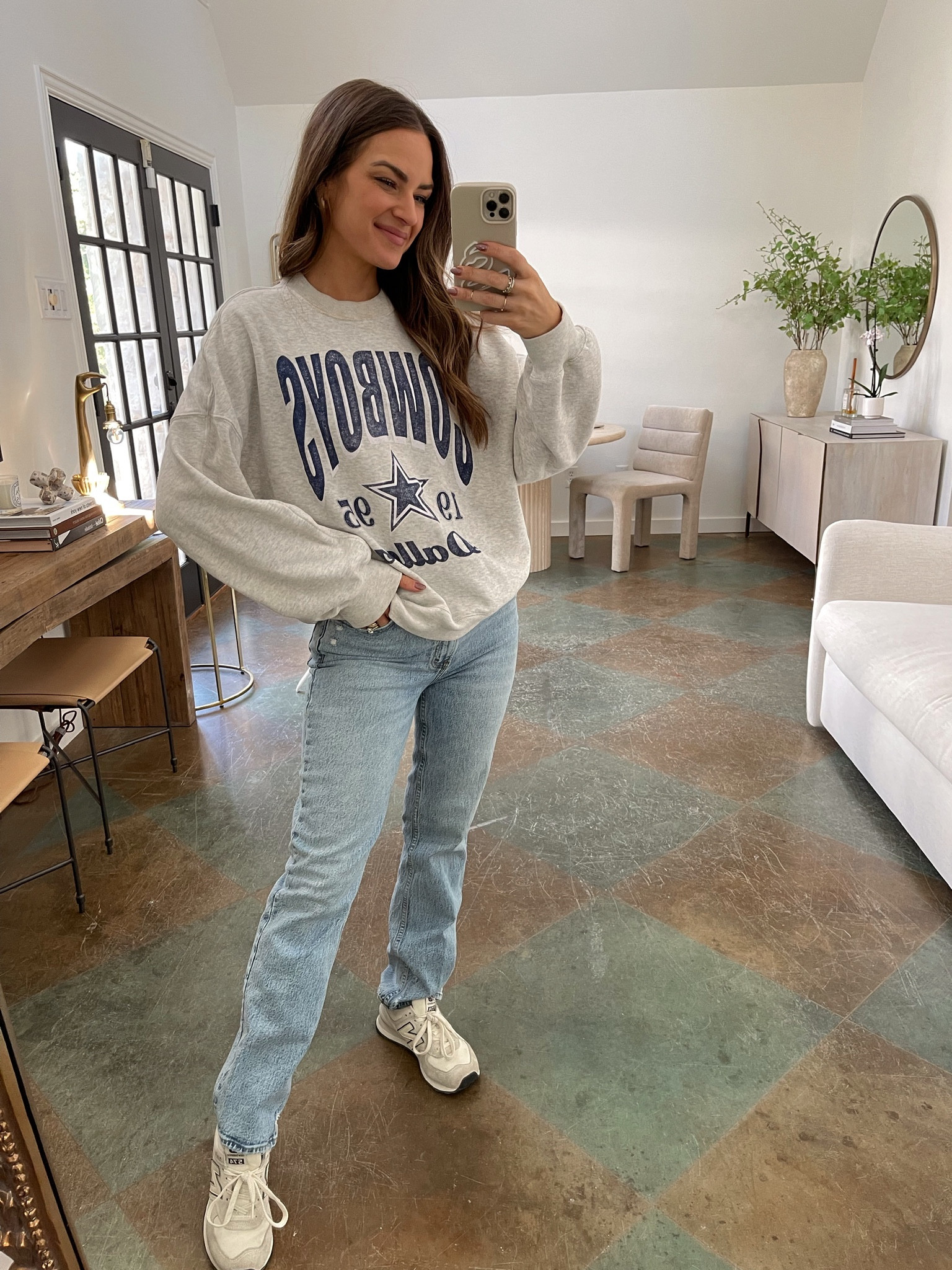Love this NFL graphic sweatshirt! I wear a size S & a 25 in the jeans. My sneakers run TTS. // fall outfit, fall denim, abercrombie jeans