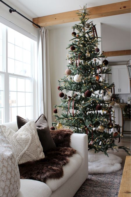Christmas tree, Christmas star, ribbon, Christmas ornament, pillow, fur blanket, rug, garland, sofa 

#LTKHoliday #LTKhome #LTKSeasonal