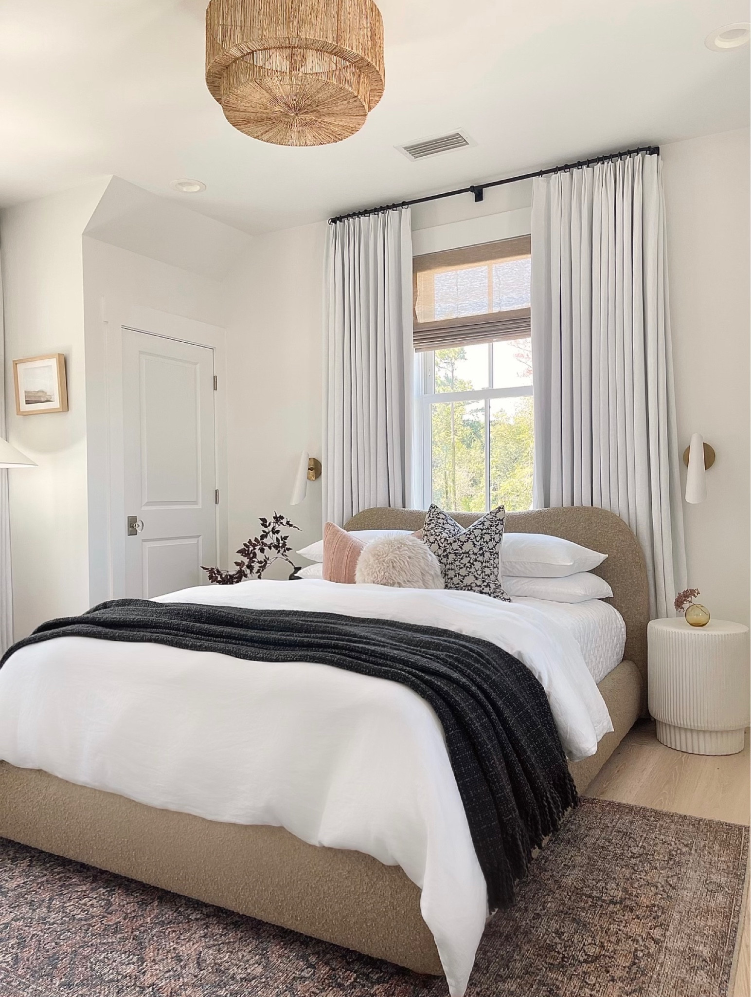 Our guest bedroom is ready for visitors!  Two of my favorite things in our guestroom is the boucle bed and our white linen curtains, and also the Loloi rug that adds a punch of color to the space!!  

Fall decor.  White bedding.  Gray throw blanket.  Bed pillows.  Floral pillow.  White sconces 

#LTKSeasonal #LTKstyletip #LTKhome