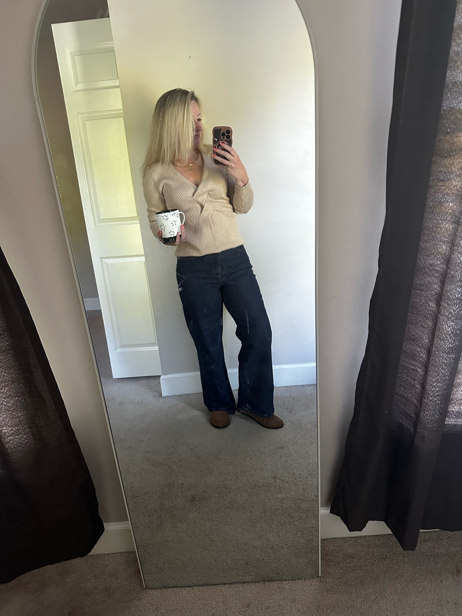 A few things that are working here:

* The darker wash elongates your legs.
* The sweater neckline breaks up your torso nicely.
* The slight tuck/shape at the waist keeps the wide leg from overwhelming your frame.
* The mule color blending with the jean hem creates a longer leg line.

#LTKPetite #LTKOver40 #LTKootd