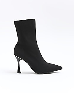 Black knitted heeled ankle boots | River Island (UK & IE)