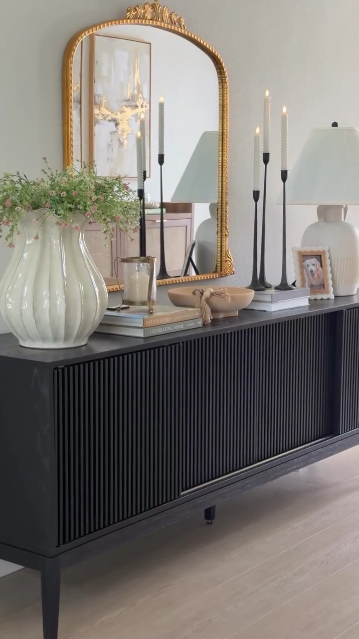 Sometimes the best decor decisions happen when you ignore the label. 🤍I may have found the ultimate entryway hack. 🤍✨

Who says a media console has to stay in the living room?

The Astrid 84” MCM Slatted Media Console (SKU9088) from @hernest_official became the perfect entryway piece—beautiful enough to welcome guests, functional enough to hold the everyday essentials, and meaningful enough to display the things that matter most.

Faux florals, favorite books, candlelight, and a photo of my first fur baby who will always have a special place in my heart. 🐾🤍

Because the best spaces aren’t just decorated—they tell your story.

Access 4th of July Early Access Sale – Up to $600 Off ✨

#HERNEST #LiveWithHernest #entrywaydecor #homedecor #cozyhome