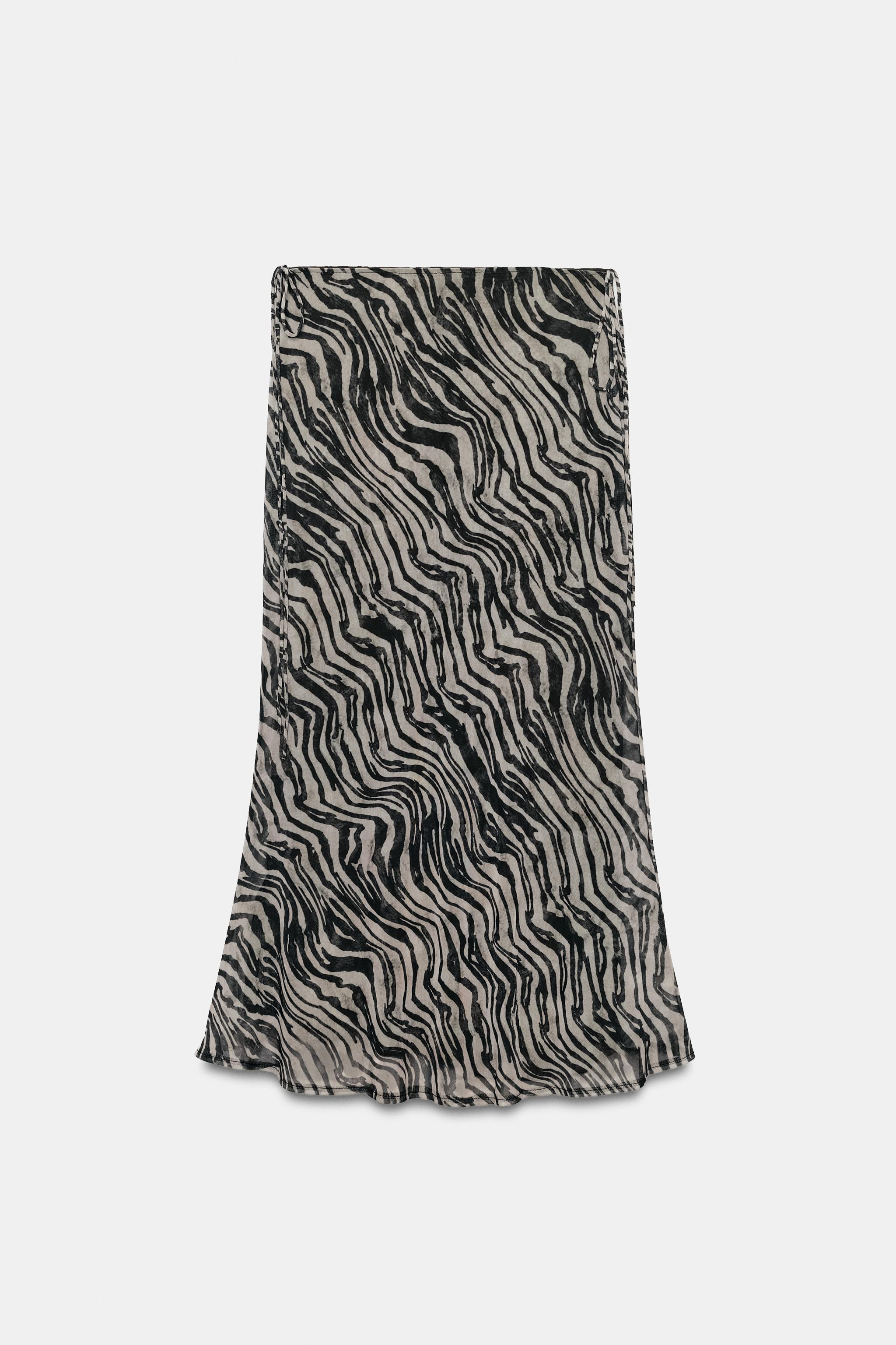 Model height: 178 cmMid-waist midi skirt. Waist featuring side slits and tie fastenings. Contrast... | Zara UK