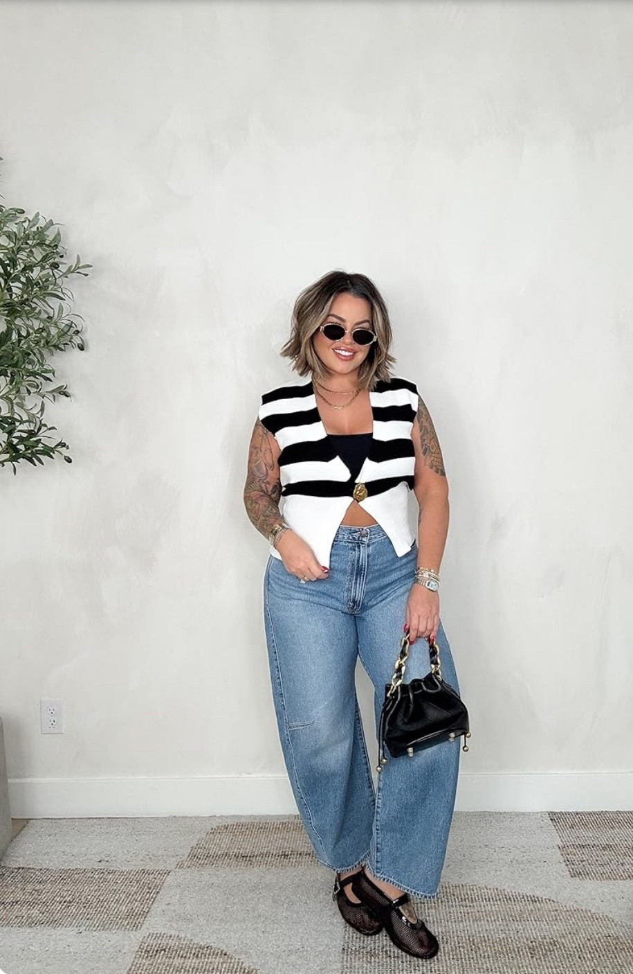 Levi’s size up 1-2 sizes, I sizes up 2 sizes to a 33.
Top L
Wearing sports bra under no link sorry 





#LTKStyle #LTKFinds #LTKCurves #LTKFashion 
#MidsizeOutfit #CurvyStyle #BlackAndWhite #NeutralOutfit #EverydayChic
#StripedVest #StatementTop #WideLegJeans #DenimOutfit #EffortlessStyle
#MinimalChic #ElevatedCasual #StreetStyleWomen #ModernClassic
#CapsuleWardrobe #TimelessStyle #ChicBasics #NeutralTones


#LTKMidsize #LTKSeasonal