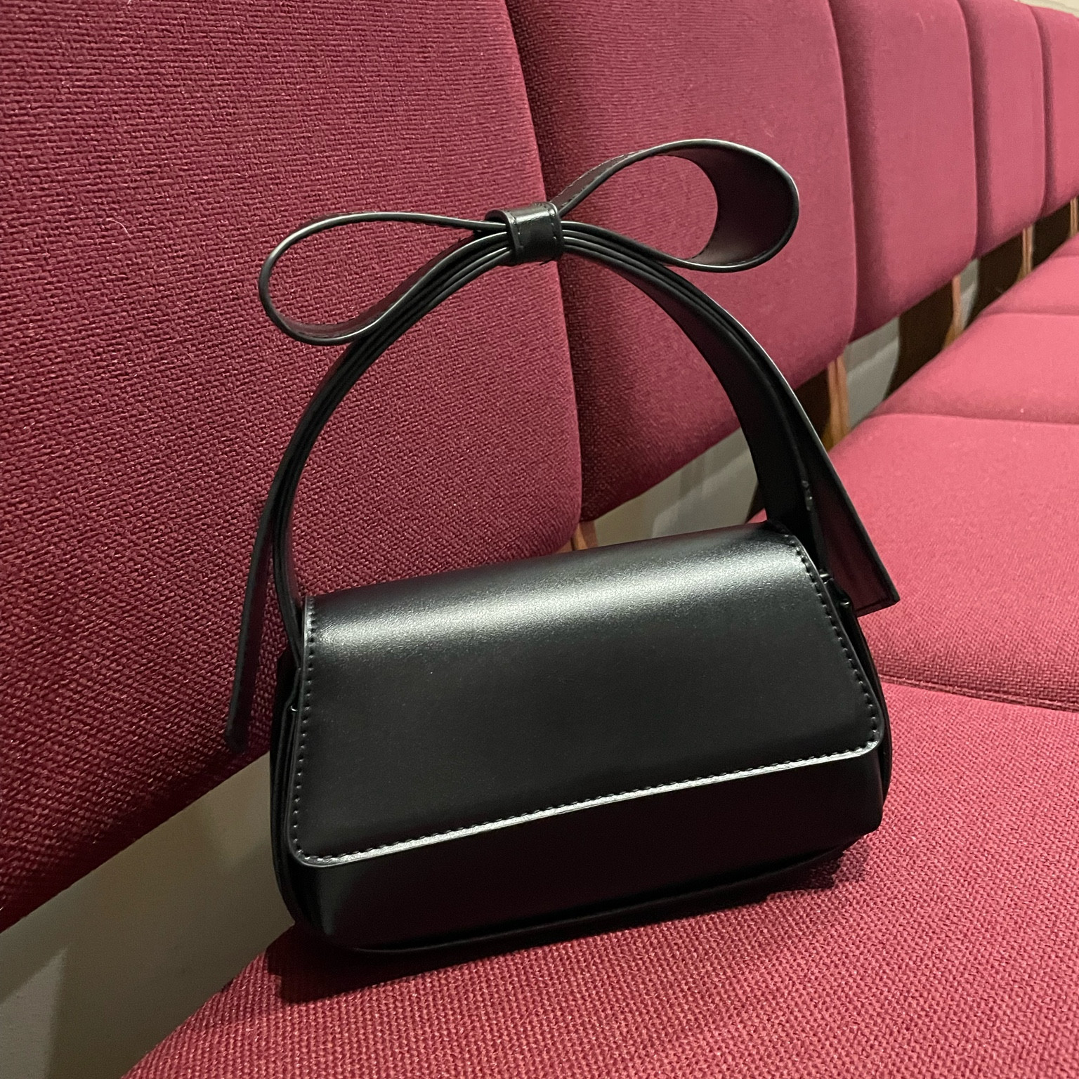 Black baguette purse with large bow top handle. The perfect amount of trendy and timeless  

#LTKItBag