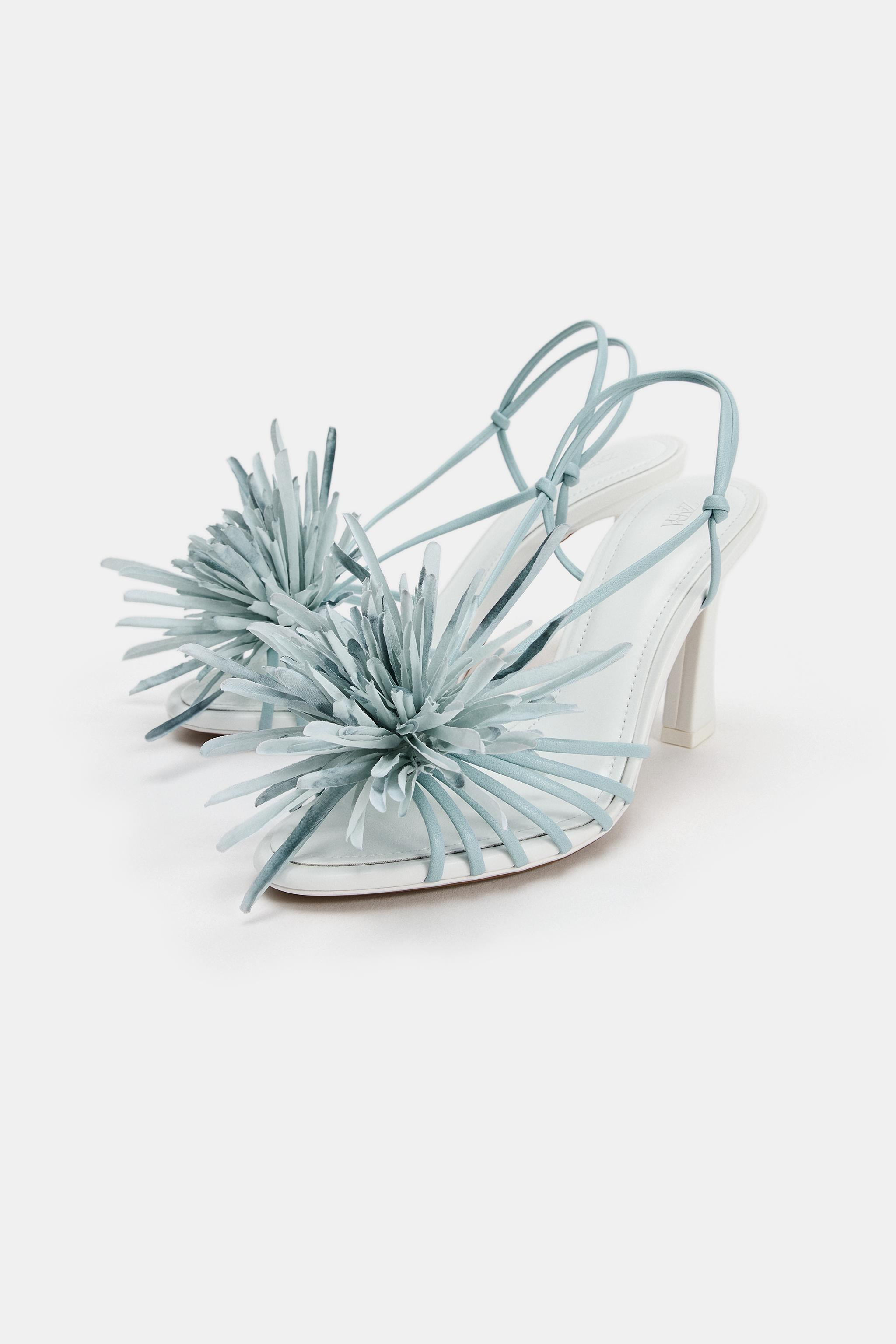 Sandals with a cage-style design. Featuring a floral detail on the front. High block heel. Rounde... | Zara US