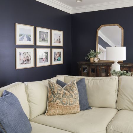 Gallery wall, pictures frames, framed art, navy living room, pb comfort sectional, wood framed mirror, large mirror, spider plant, white and brass lamp, palna pillow cover, blue linen pillow cover

#LTKFind #LTKhome #LTKstyletip