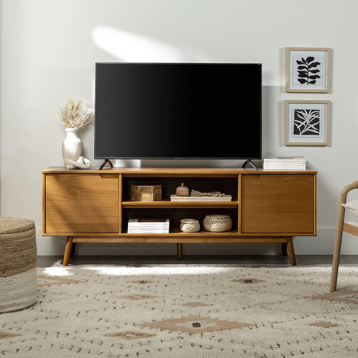 This TV stand features plenty of surface space to keep a 75" TV along with other accent pieces. I... | Wayfair North America